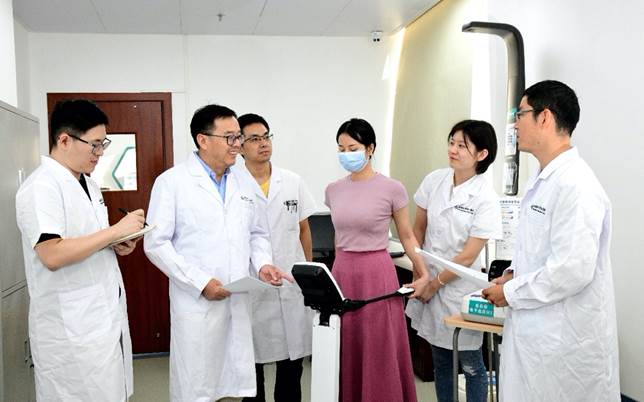 a group of people in white lab coatsdescription automatically generated with low confidence a group of people in white lab coatsdescription automatically generated with low confidence